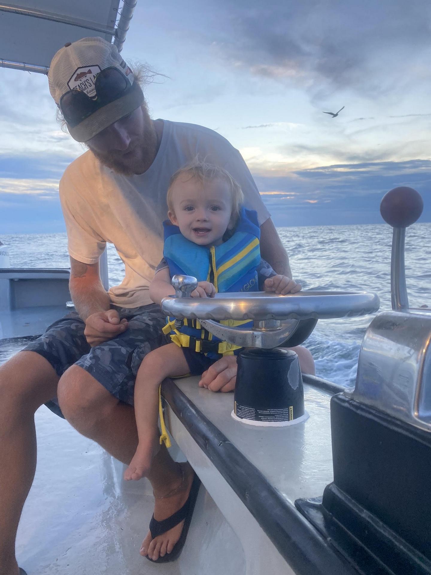 Young angler with catch aboard The Hook Up