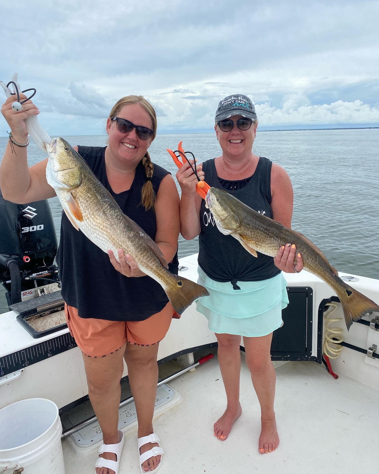 Two ladies with red drum